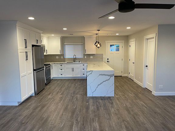 Laundry room and 1/2 bath to the right