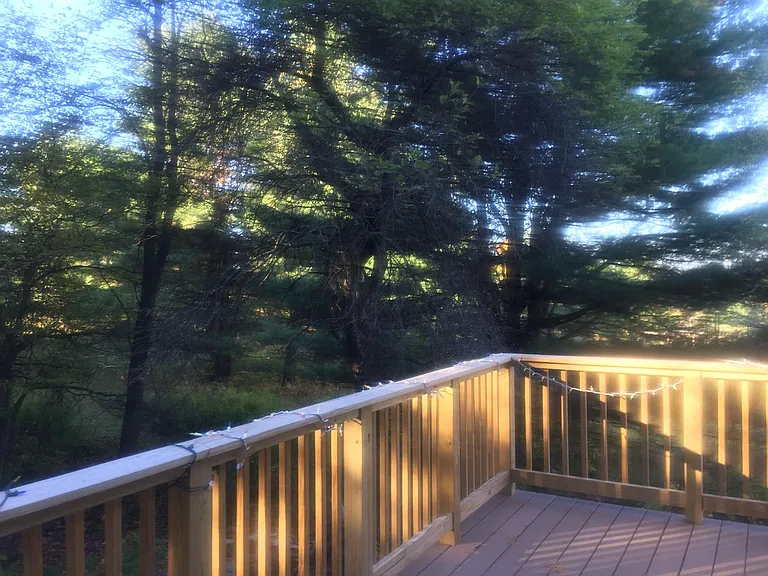 Deck is the length of the house, southwest corner.