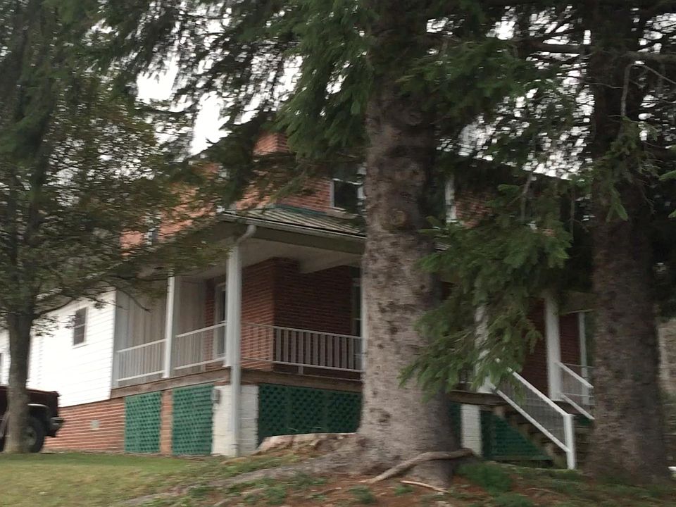 Wrap around front porch. Second unit of the duplex showing i