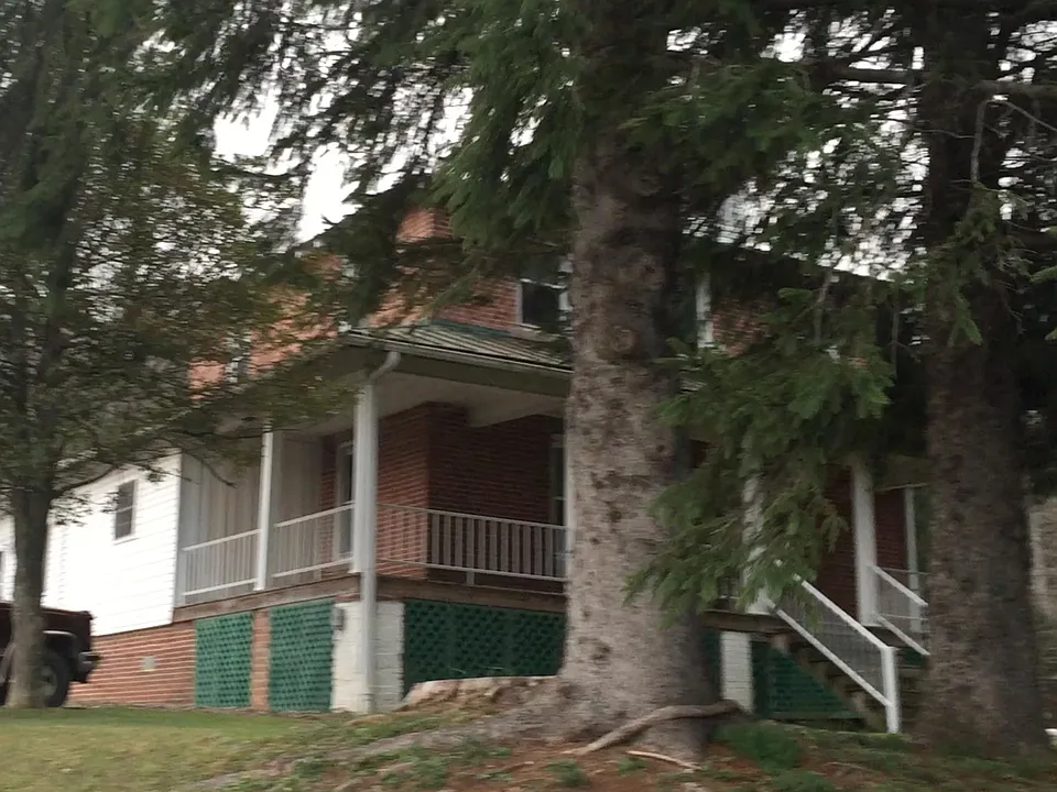 Wrap around front porch. Second unit of the duplex showing i