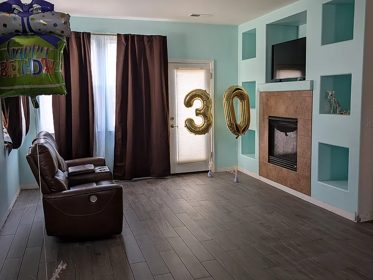 View from kitchen to living room. Beautiful new wood look tile floors - wall color is now white.