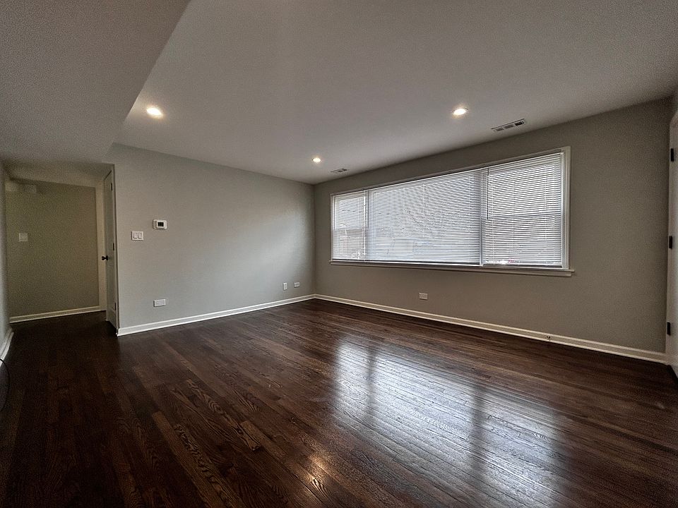 Large 15x13 Living room with refinished flooring and new window
