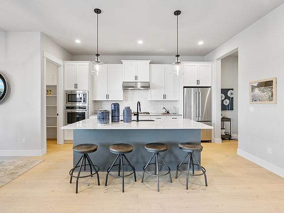 Well-designed kitchen with large walk-in pantry