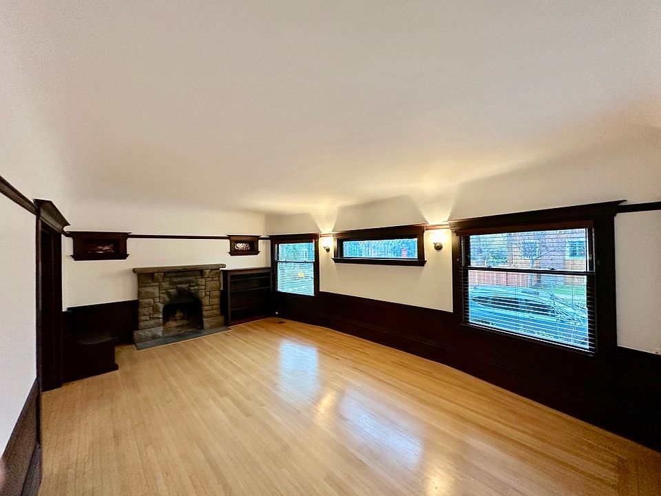 Large living room with tall coved ceilings and beautiful HW floors.