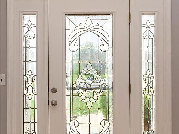 Beautiful lead glass front door with side lights