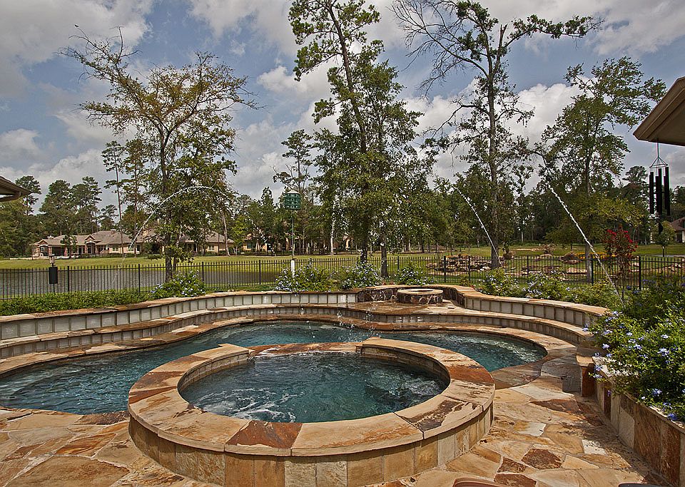 Home was designed around panoramic views of lakes, fountains, saltwater pool.