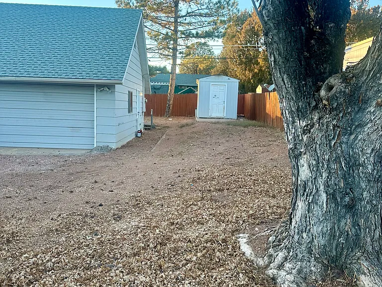 Outside, looking towards garage and storage.