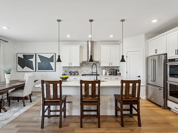 The beautiful kitchen has gorgeous quartz countertops.