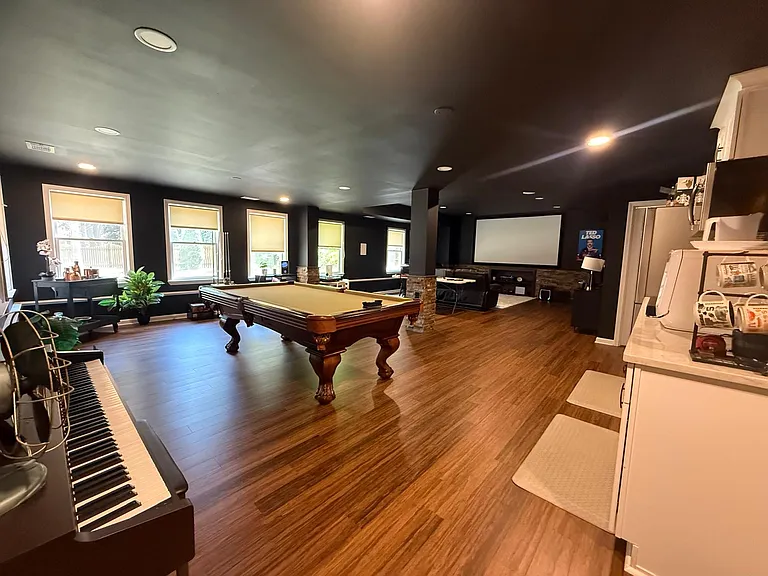 Basement Entertainment Area with Theater and Kitchen