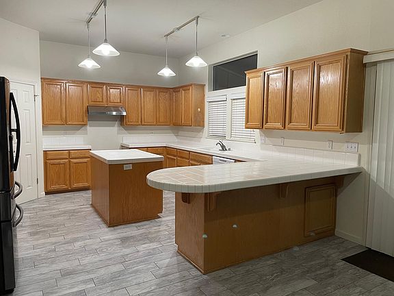 kitchen update: new tie floor, new appliances (deluxe fridge, gas range, dishwasher, stove fan)