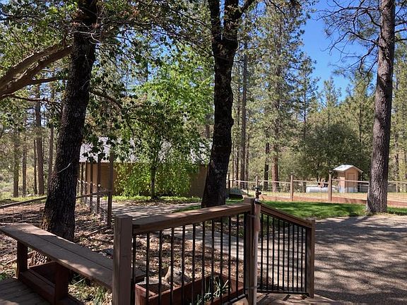 Fenced back yard with deck and patio