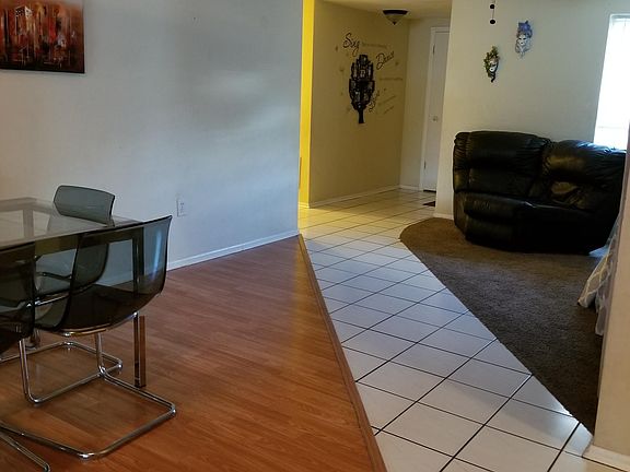 Front door opens to separate living and dining areas!