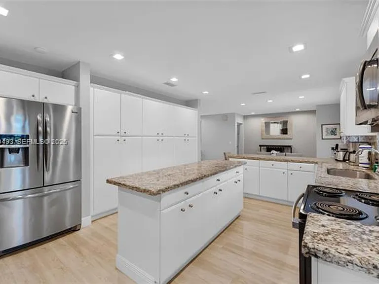7711 Coquina Dr — Photo 6