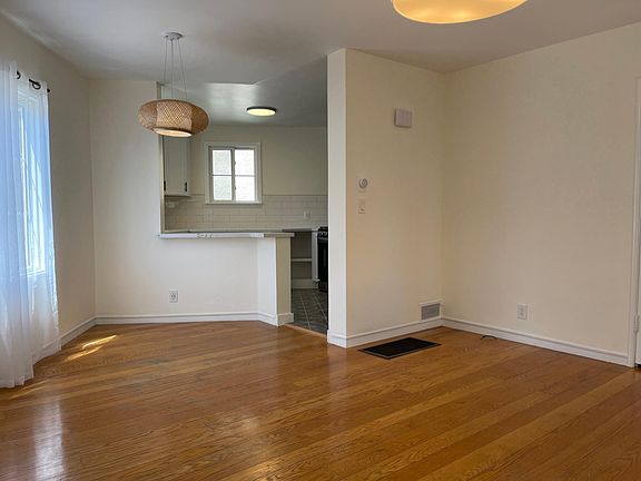 living room and dining room with kitchen bar.