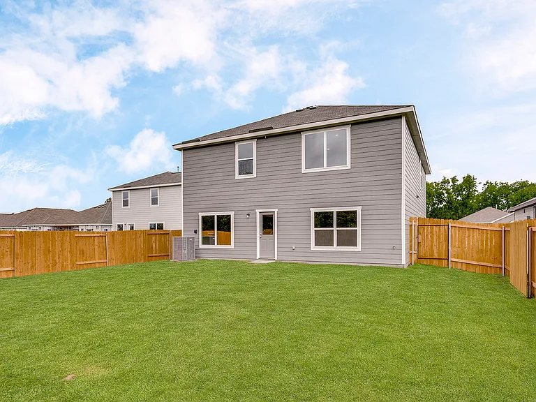 The back yard is fully fenced-in.