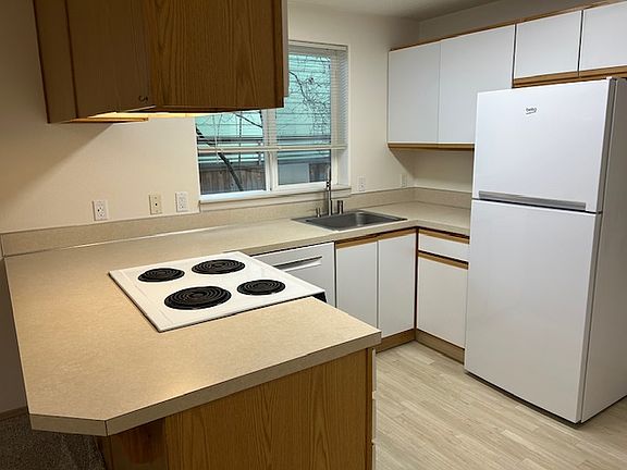 kitchen with newer appliances. Pull a stool up to the bar