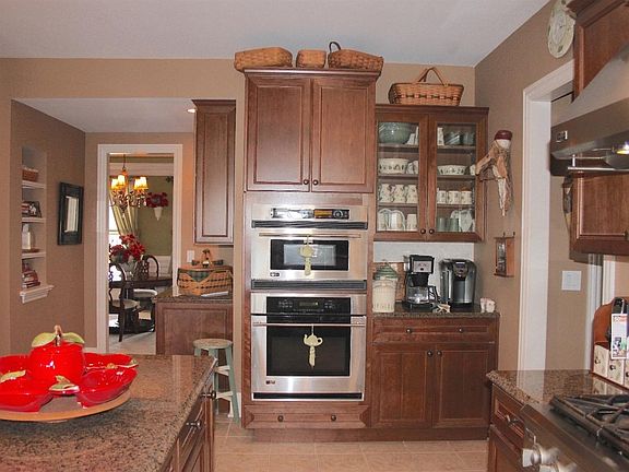 Large eat-in kitchen overlooks the great room and walks out to an over-sized screened porch.