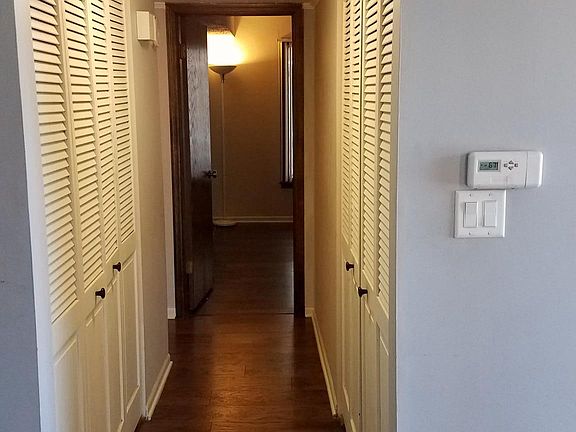 Hall with laundry in closet