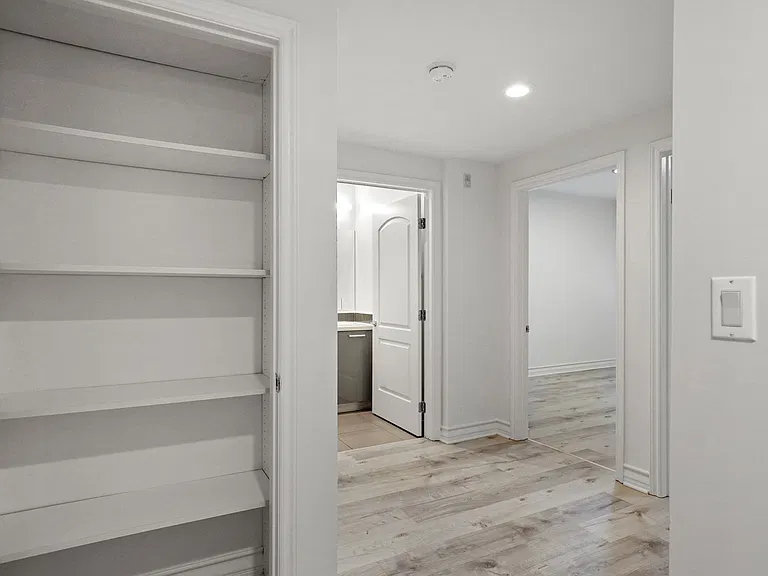 Hall Closet with Built-In Shelving