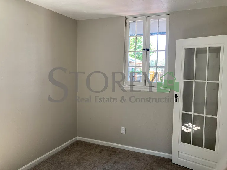 Main level bedroom with attached full bathroom
