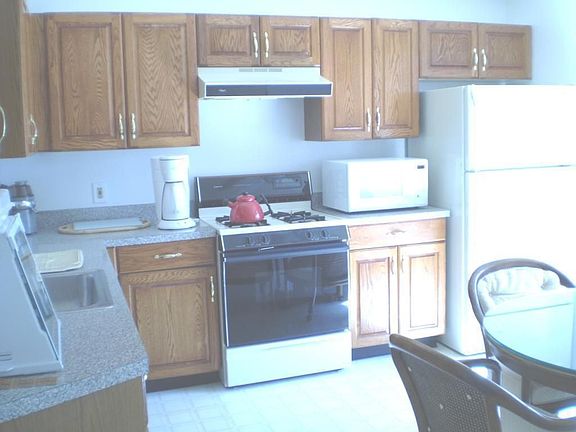 large eat in kitchen with pas through to dining room
