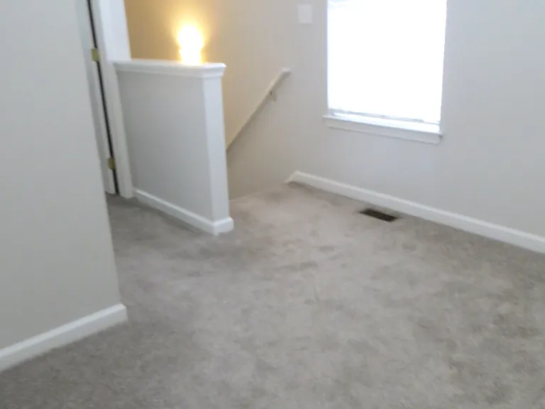 Loft big enough for office nook, exercise equipment.