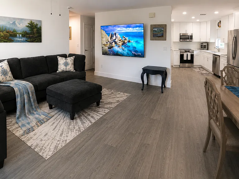 Enjoy immersive viewing from the oversized sectional and 85" Smart TV setup. Designed for relaxing evenings with expansive seating and large-screen entertainment.