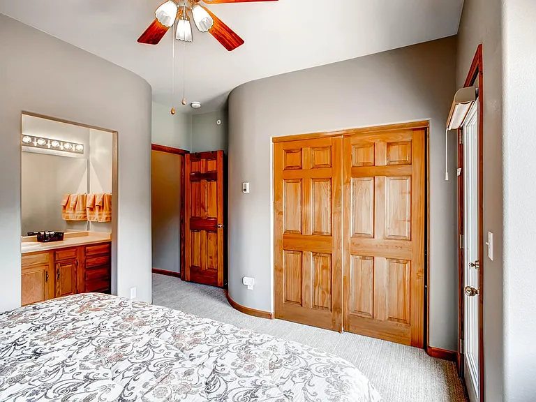Third floor bedroom with private vanity and bathroom