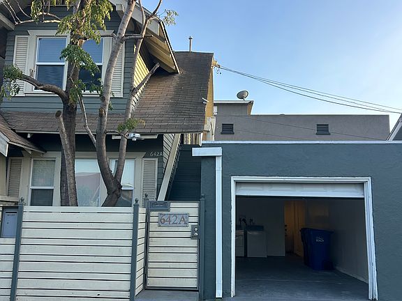 Front Entrance (Gated) + Open Garage