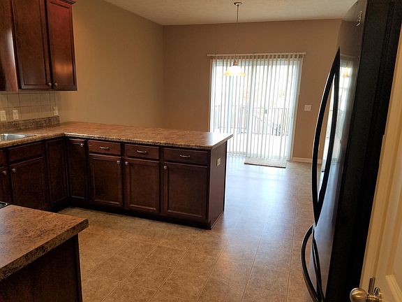 Kitchen looking towards adjoining dining room. Deck off dining leads to back yard