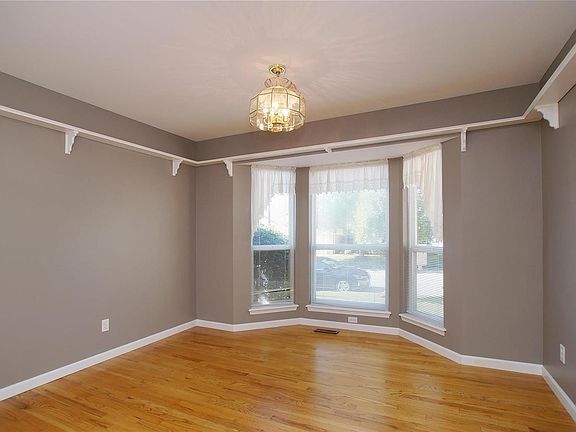 Breakfast room freshly pained,  bay window and decorative shelving