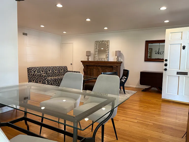 Coming in your front door. Living room with dining area.