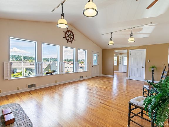 The use of this room changes with owners. Once a family room with grand piano. Full size dining room & last as an office for two. You'll have a view of our Rainbow Bridge too. 