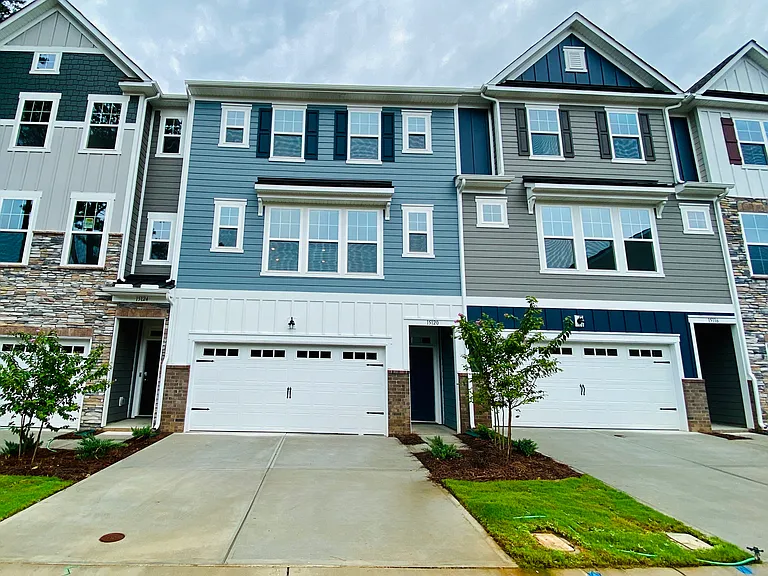 Front of the town home, one in blue.