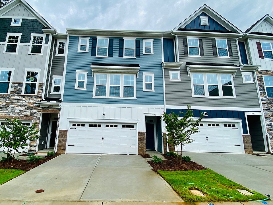 Front of the town home, one in blue.