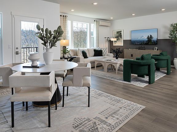 Leaving room + dining room with balcony facing the green belt