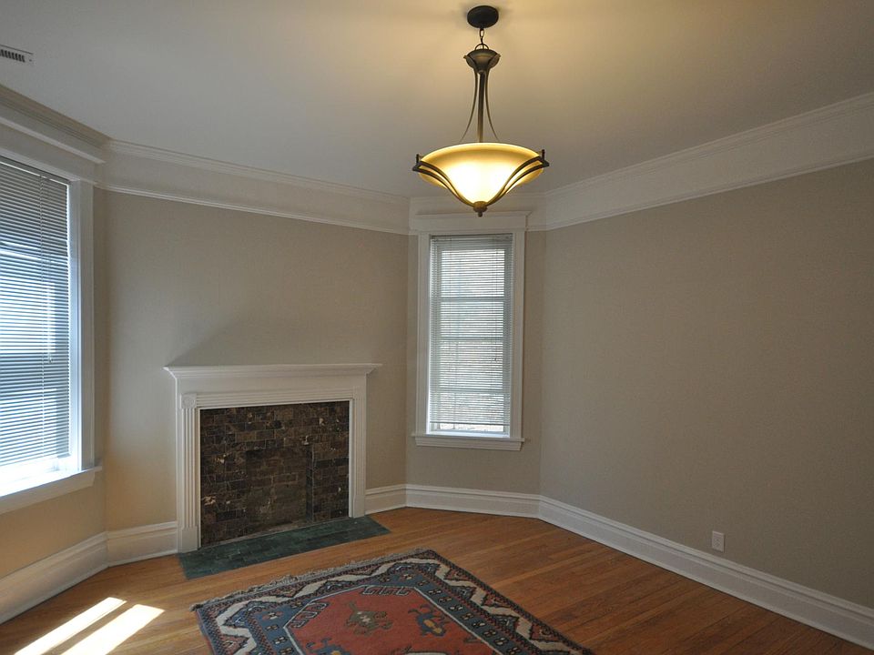 Bedroom with decorative fireplace