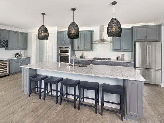 Open Kitchen with a large island that flows into the Gathering Room