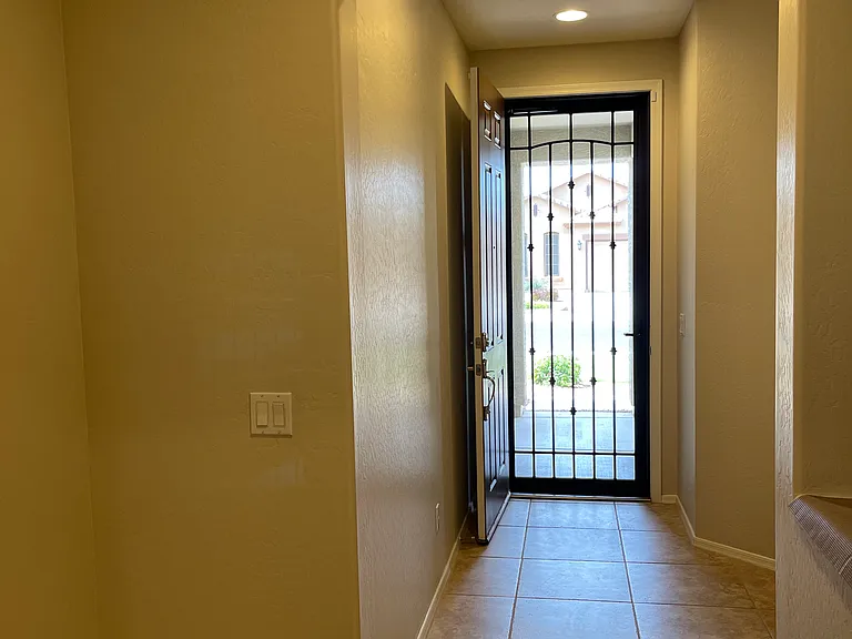 From inside the home looking to the front door/security screen.