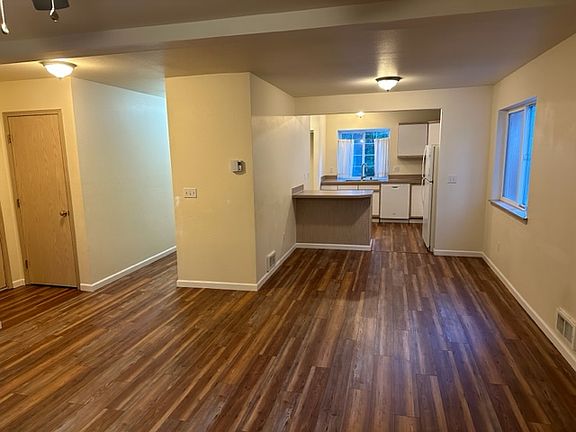 View showing entry closet to the left with a good view of living room