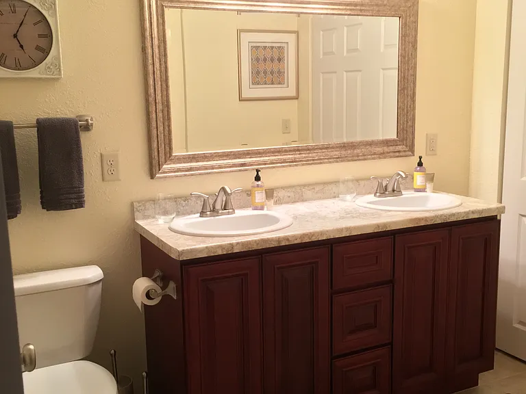 Large bathroom with double sink and shower/tub