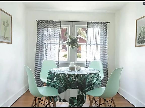 The kitchen is suitable for a four-person table and chairs and gets plenty of natural light throughout the day -- perfect lighting for Zoom calls.