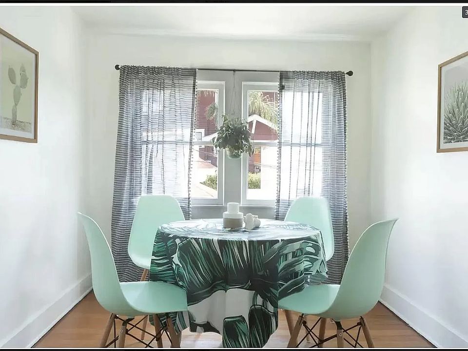 The kitchen is suitable for a four-person table and chairs and gets plenty of natural light throughout the day -- perfect lighting for Zoom calls.