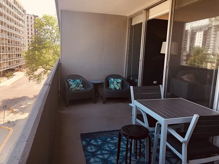 Balcony with lounge area and even room for bicycle storage.