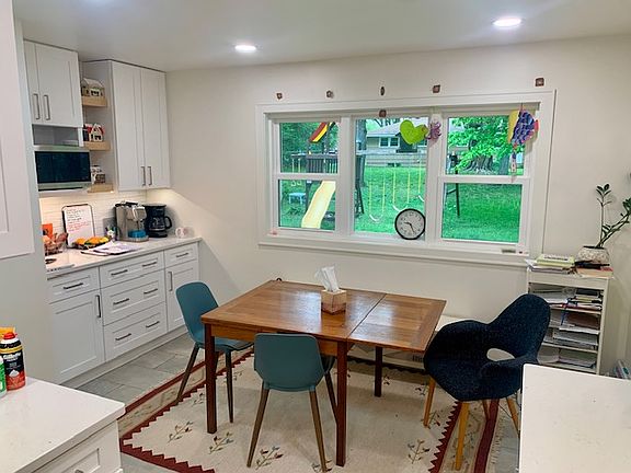 Updated Kitchen 2024 - beautiful tile floors, quartz countertops, all new appliances. New large window looks out over backyard.