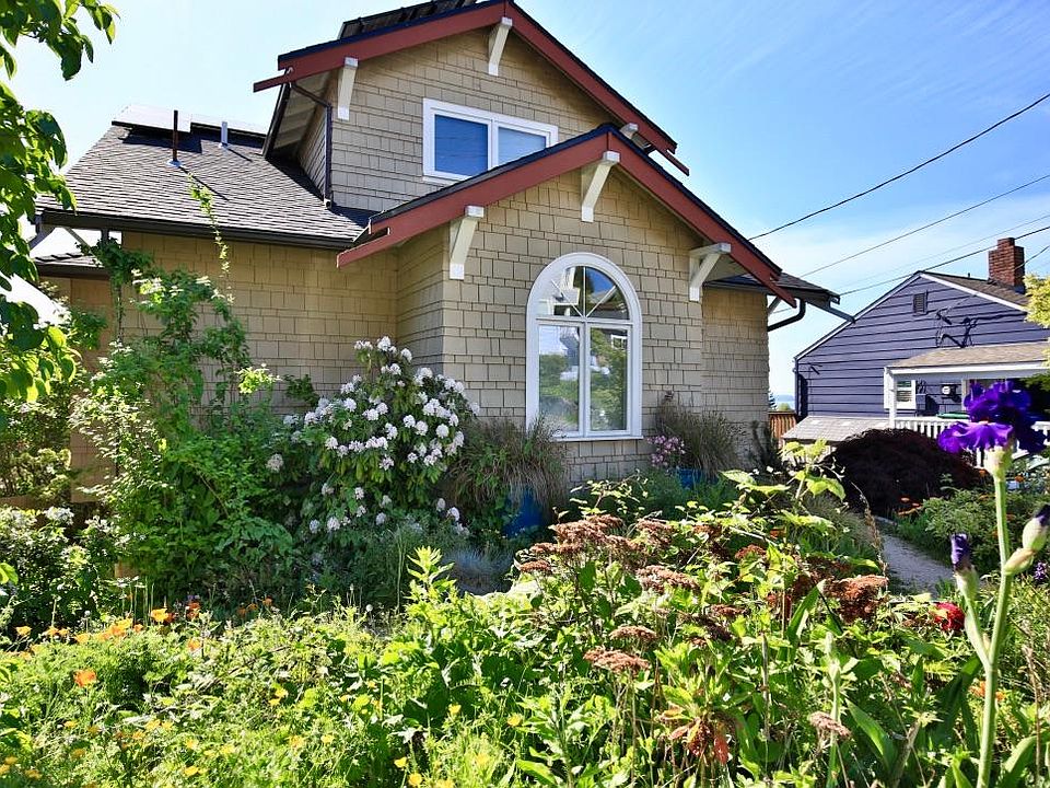 Street side of house with native plantings. Third bedroom is located directly above.