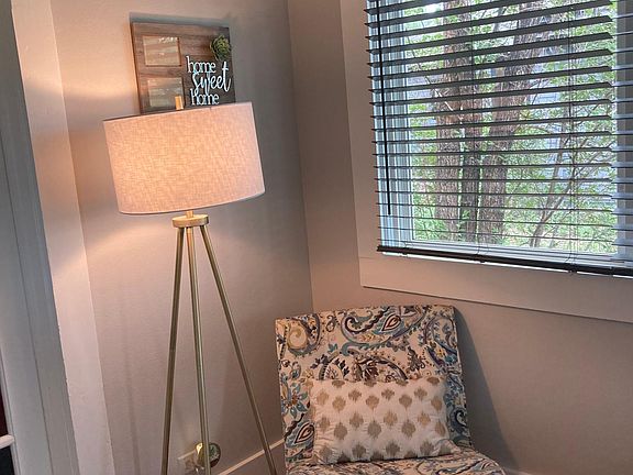 Corner of front hallway. hallway is lined with windows on one wall