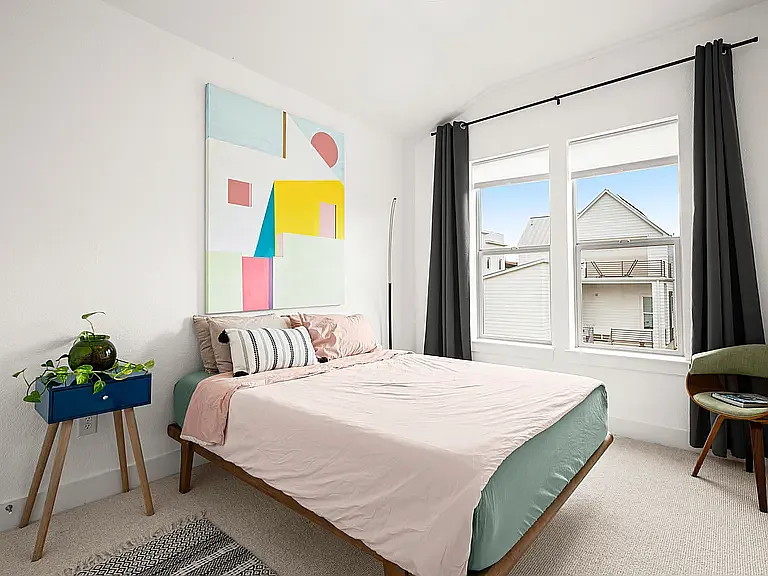 Both secondary bedrooms are generously sized with abundant natural light and share a well-appointed full bathroom, making them ideal for family, guests, or a home office.
