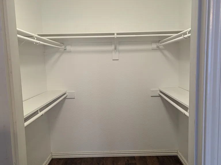 Walk-in primary bedroom closet