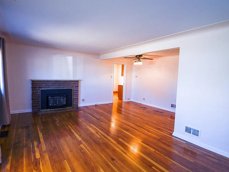 As you walk in from front door. Living room & Dinning room. View into kitchen as well.